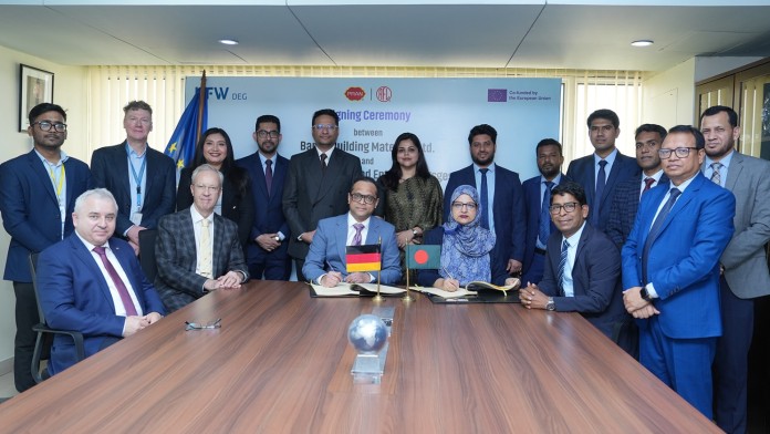 People gathered around a meeting desk after signing a contract