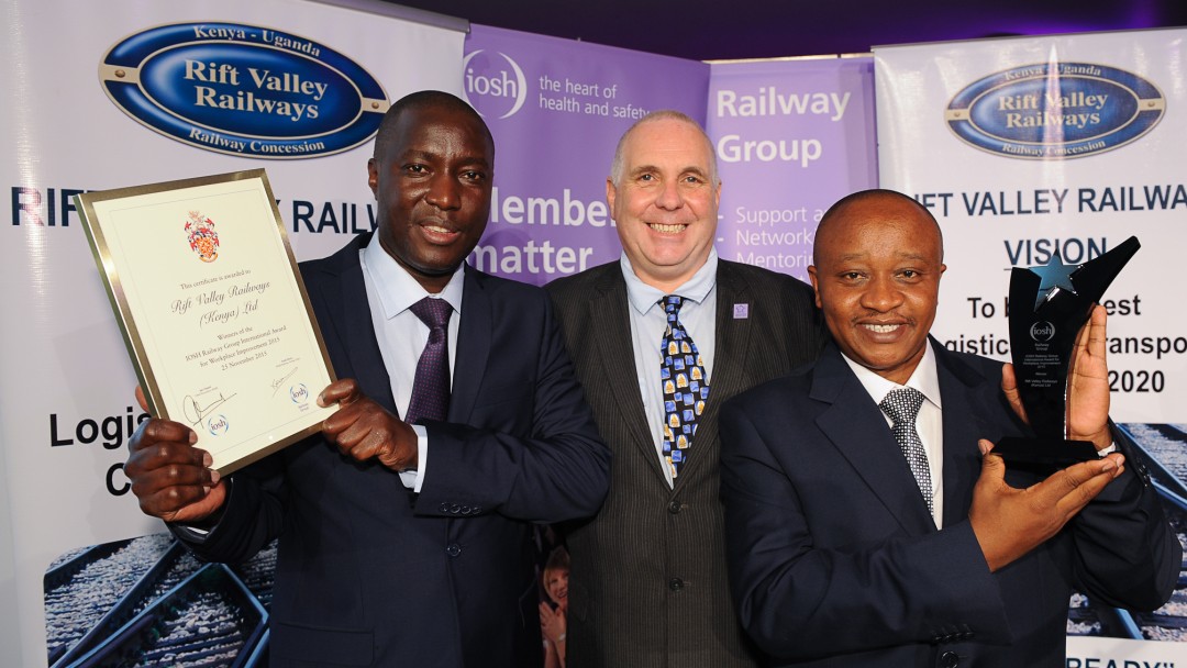 Paul Kabaale (left) and Tom Nyaga (right) of Rift Valley Railways (Kenya) Ltd receive the first IOSH Railway Group International Award from Group Chair Keith Morey.